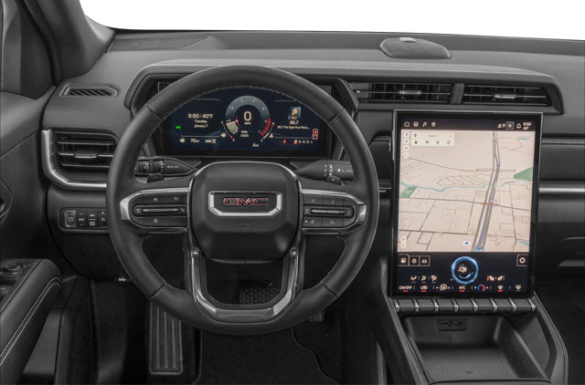 A modern 2026 GMC Terrain interior showing a steering wheel and a large touchscreen display with navigation.